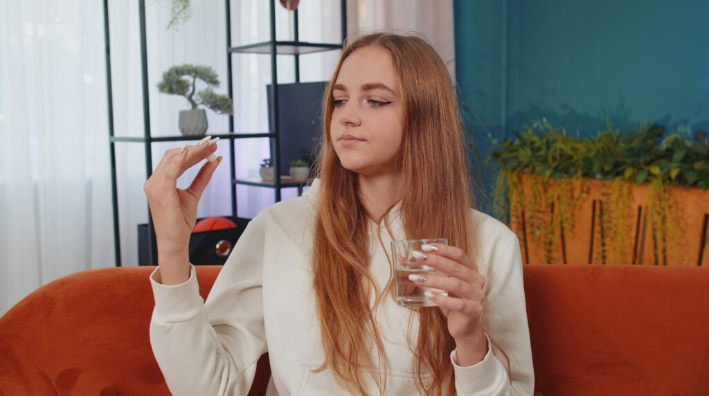 young woman taking weight loss medication